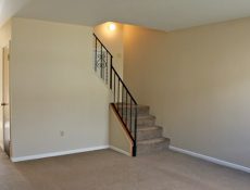 View of an empty living/family room in a townhome.