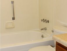 Another view of the sink and bath/shower in a full bathroom.